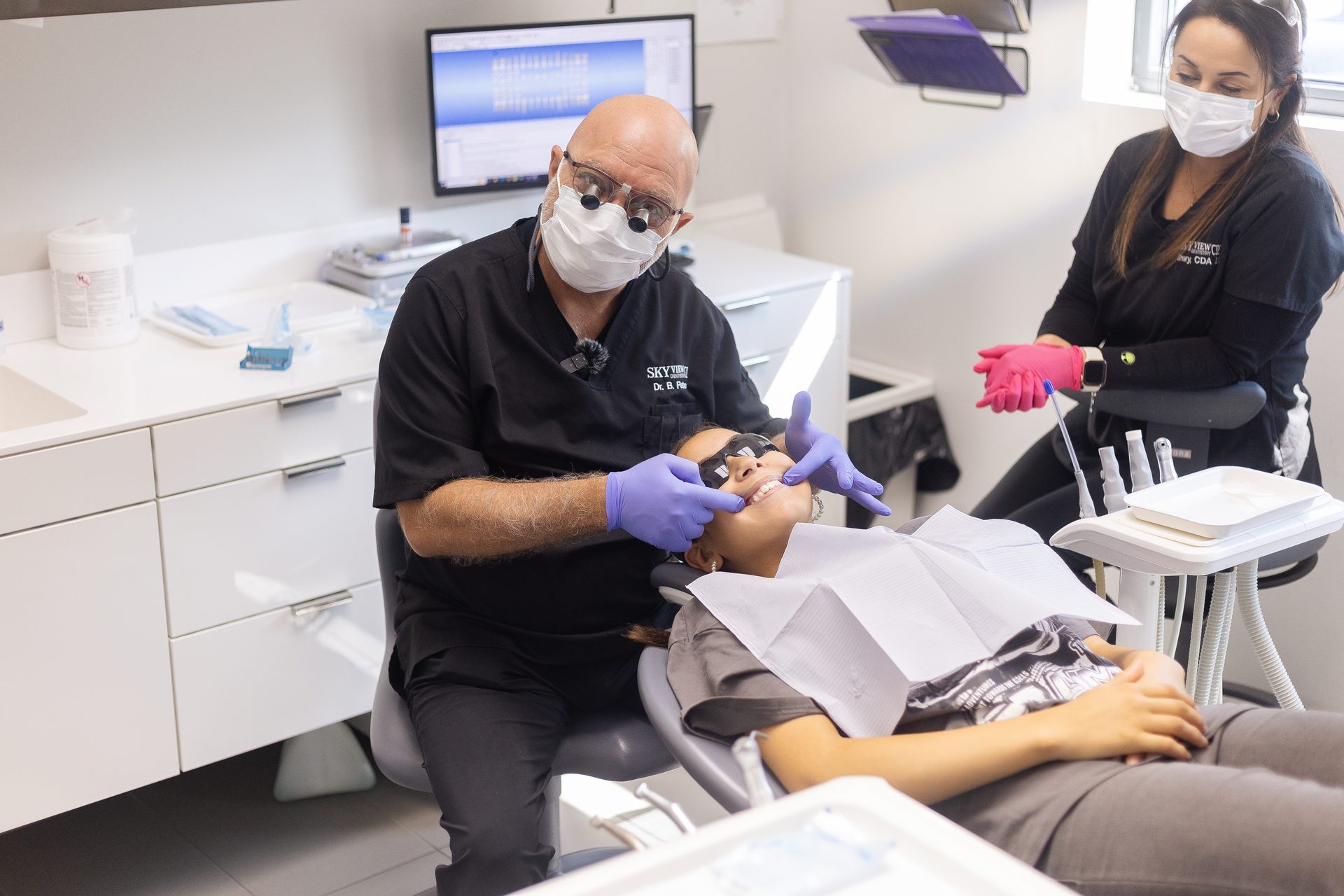 Dr. Petros treating a patient at Skyview Dentistry